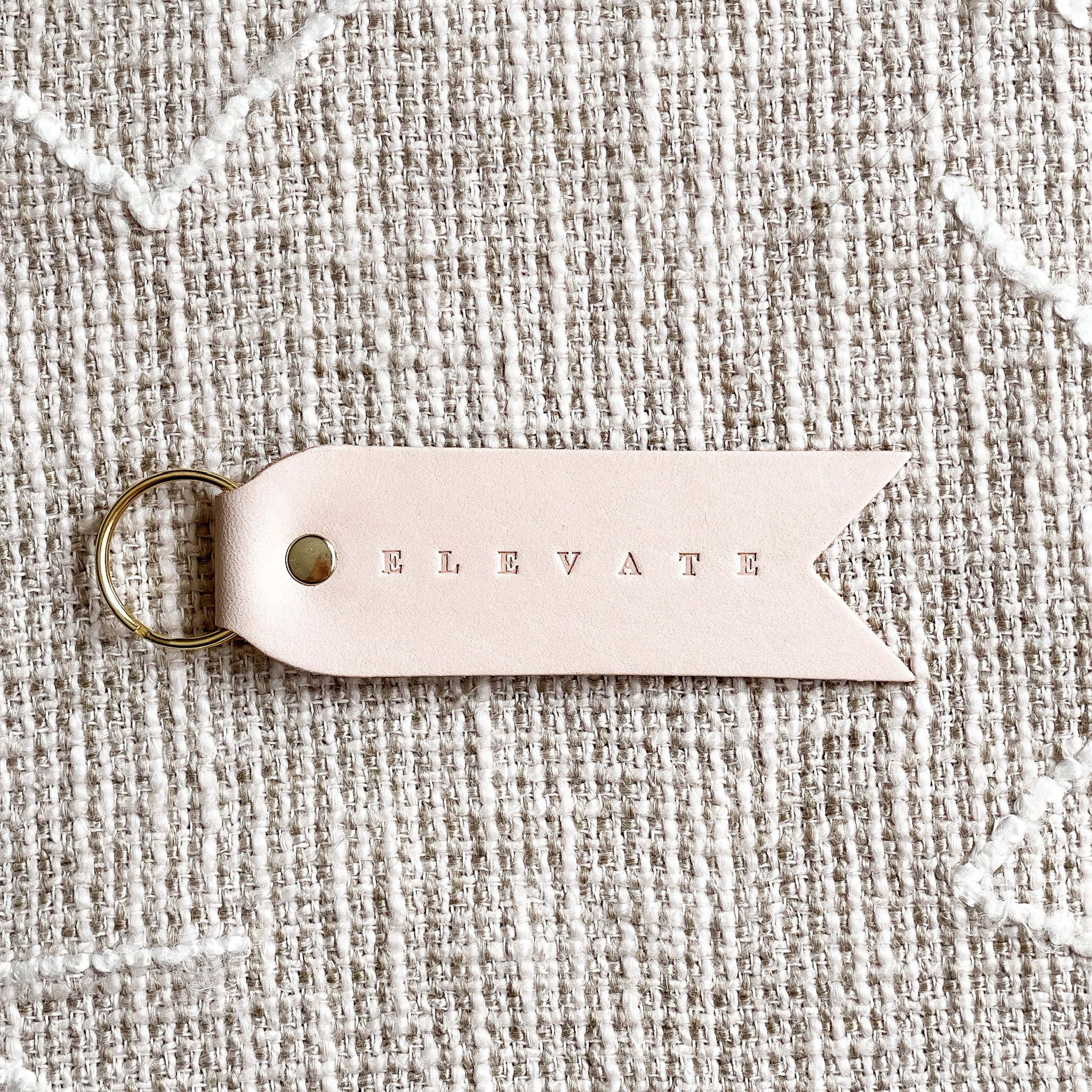 'ELEVATE' Ivory Leather Keychain by Twin Sparrow